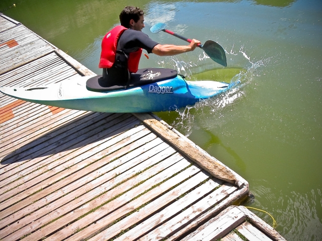 Kayaker launches into the water
